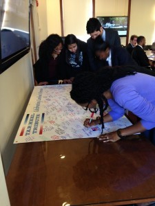 Image of Students signing a Tar heel Tribute Banner