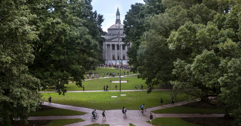 An aerial shot of Polk Place with students walking on walkways across campus