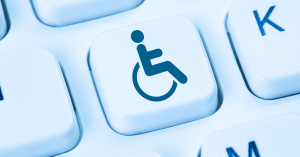 Stock photo of a keyboard featuring featuring the blue national handicapped icon
